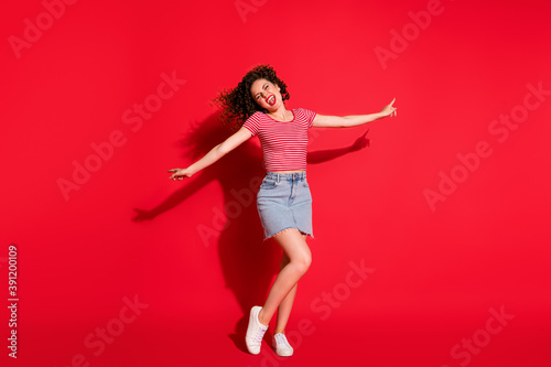 Full body photo of crazy attractive girl have fun enjoy wear mini skirt yell isolated over red color background