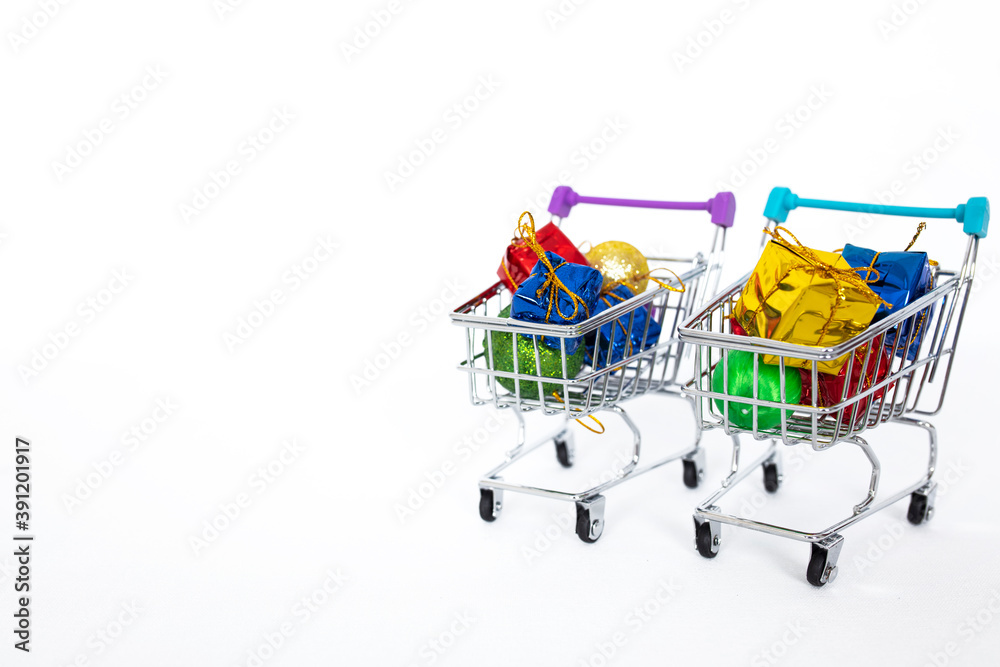 Christmas and New Year shopping. Shopping cart full of gifts
