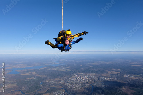 Fototapeta Naklejka Na Ścianę i Meble -  Skydiving. Tandem jump. Flight in the sky.
