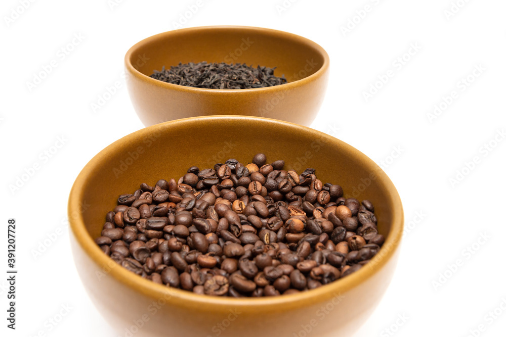 Bowls with coffee and dried tea on a white background