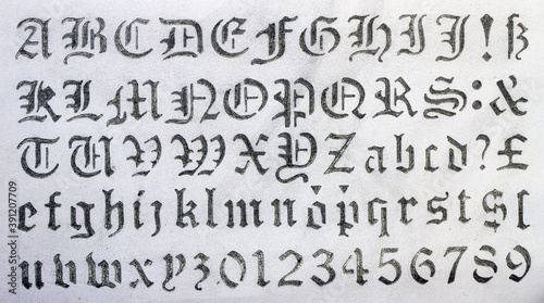 medieval alphabet stencil text with a pencil 