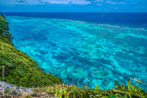 The Sankakuten landmark on Irabu Island, where a tropical reef meets the coastline cliffs. Miyakojima, Okinawa, Japan © Paul Atkinson