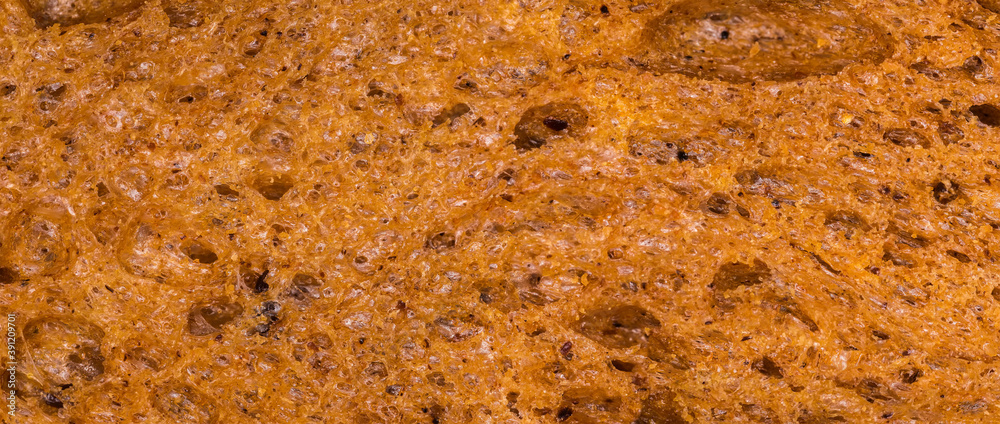 Texture of wheat-rye brown bread, close-up