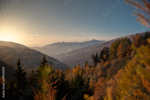 View of the city of Bogno in Switzerland. Sunset and view of the mountain walk to the Capanna di San Lucio with autumn colours.