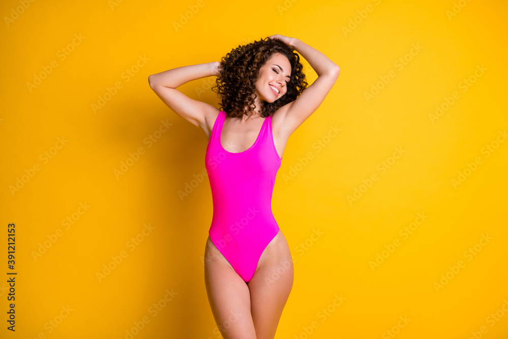 Photo of attractive wavy lady overjoyed sun exotic island all inclusive resort eyes closed sun bathing seashore wear pink swimsuit isolated bright vivid shine yellow color background - obrazy, fototapety, plakaty 
