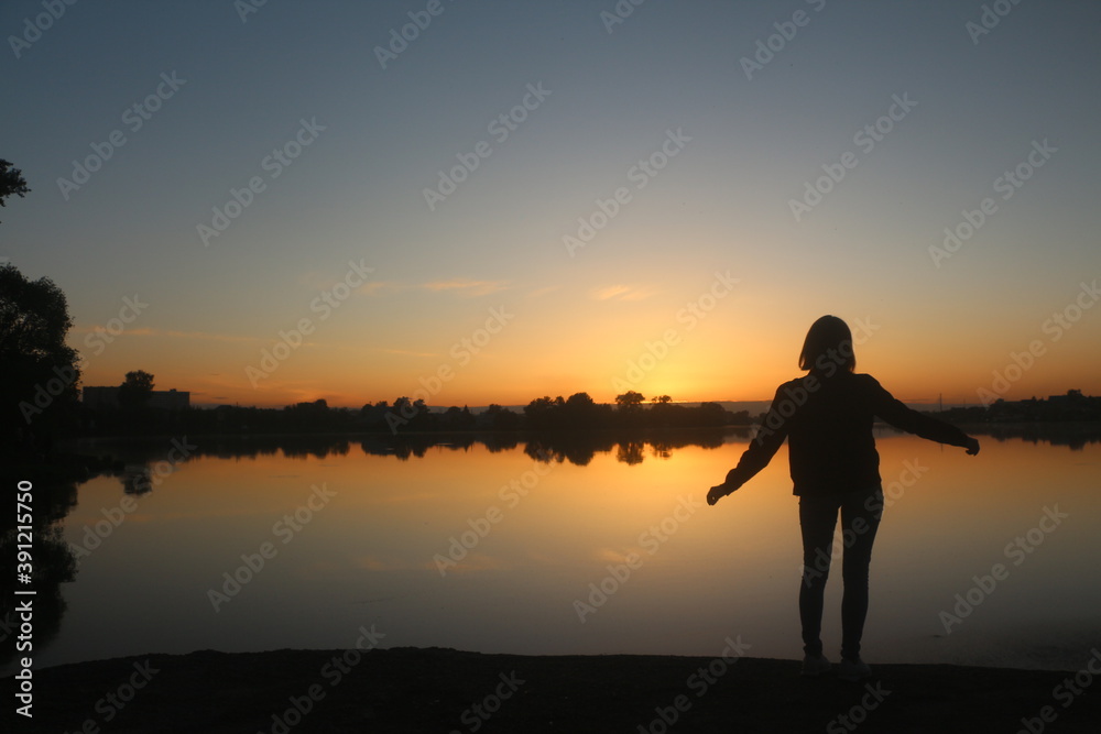 silhouette of a person in a sunset