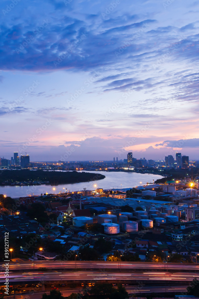Aerial view of Bangkok skyline at twilight.