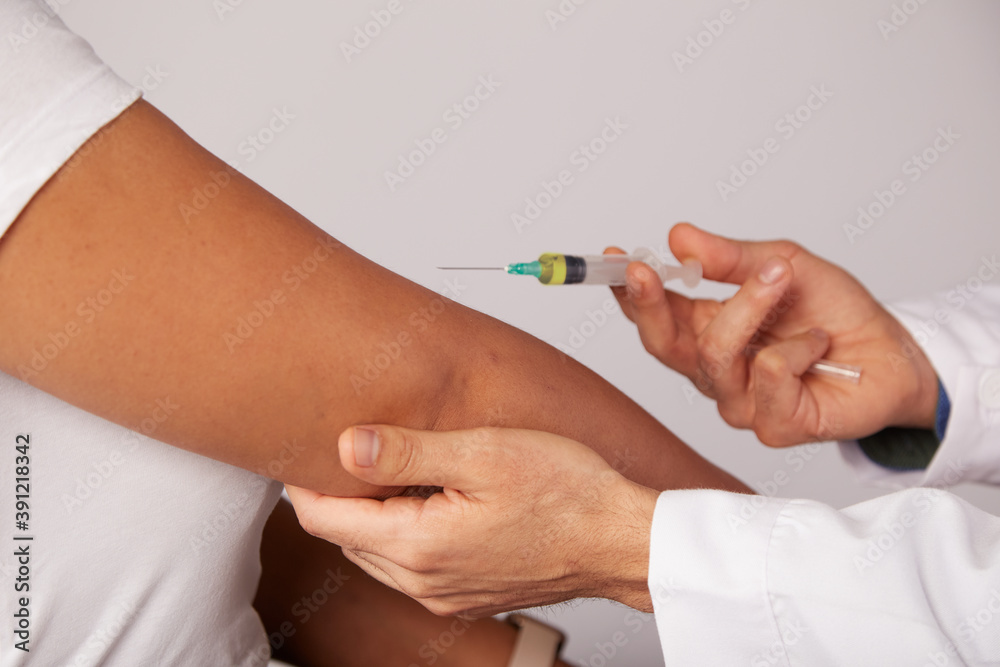 Concept of medicine and health care The doctor giving the patient a coronavirus vaccine Concept of medicine and health care The doctor giving the patient a coronavirus vaccine