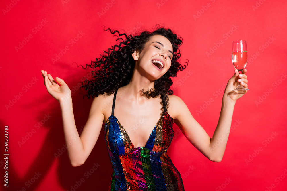 Portrait of stunning dreamy cheerful wavy-haired girl drinking wine dancing having fun isolated on bright red color background Portrait of stunning dreamy cheerful wavy-haired girl drinking wine dancing having fun isolated on bright red color background