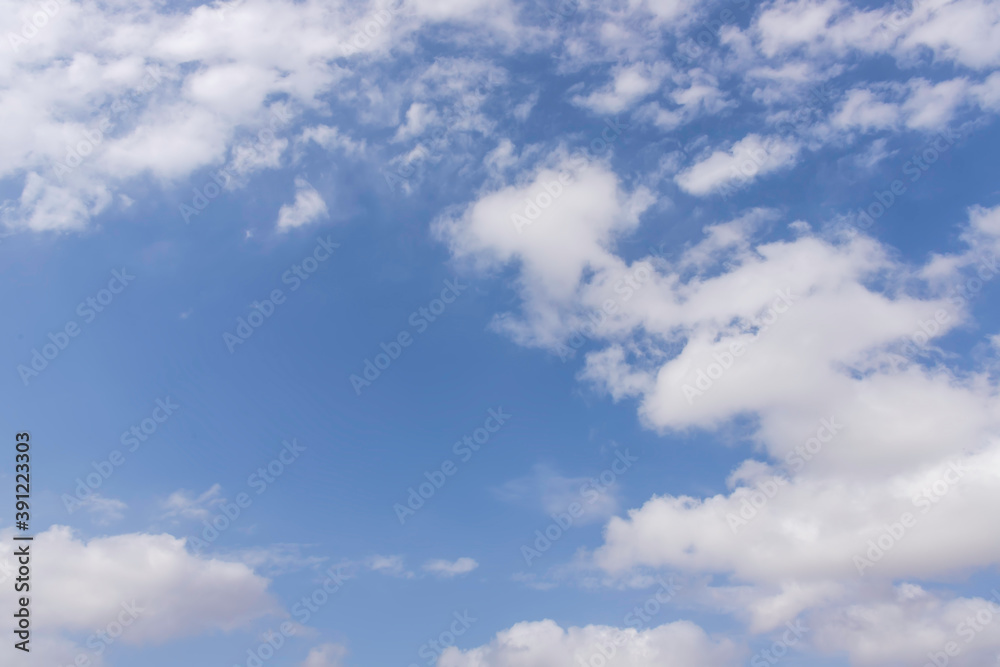 Background of blue sky with white clouds. Skyscape. Graphic design