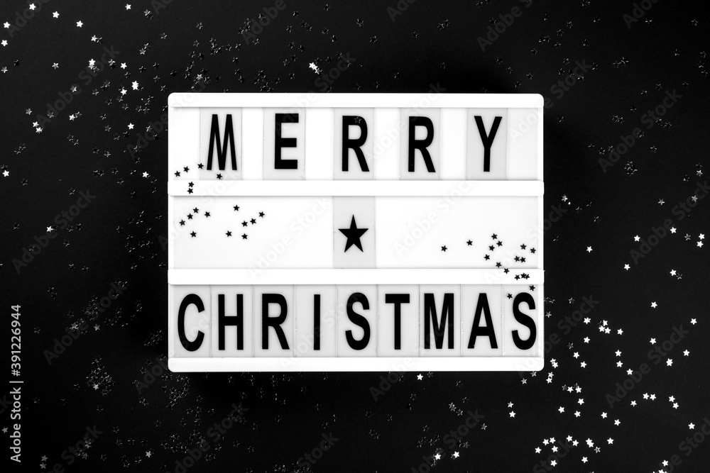 Merry Christmas lettering on lightbox.Festive composition Merry Christmas lettering on lightbox.Festive composition