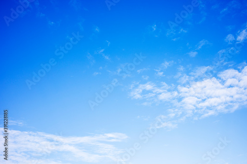 Blue sky background and white clouds soft focus, and copy space 