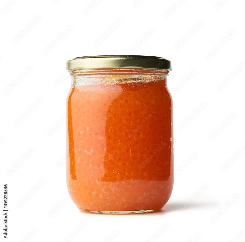 glass jar with fresh pink salmon caviar isolated on white background glass jar with fresh pink salmon caviar isolated on white background