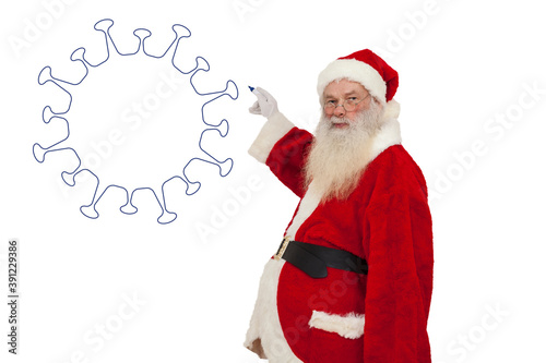 Weihnachtsmann malt Corona Virus an eine Wand photo