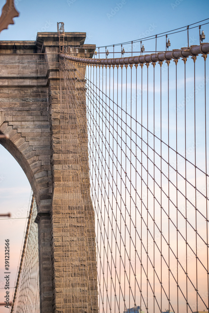 Fototapeta premium Sunset colors of Brooklyn Bridge with giant tower