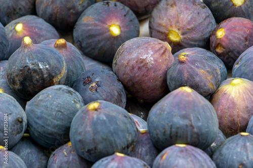 Fresh figs on the counter of a fruit market or store. Southern summer fruits