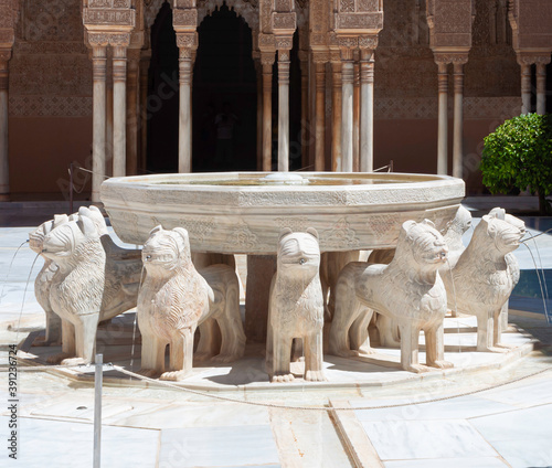 Splendid Lion fountain in Court of Lions (Nasrid Palace, Alhambra), surrounded by complex arcade with muqarnas arches and sebka decors,