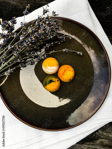 chocolates on a plate and lavender branch