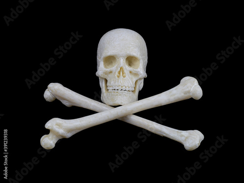 human skull and crossed bones on a black background, a sign stop, be careful, dangerous.