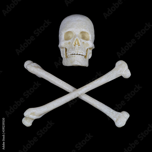 human skull and crossed bones on a black background, a sign stop, be careful, dangerous.