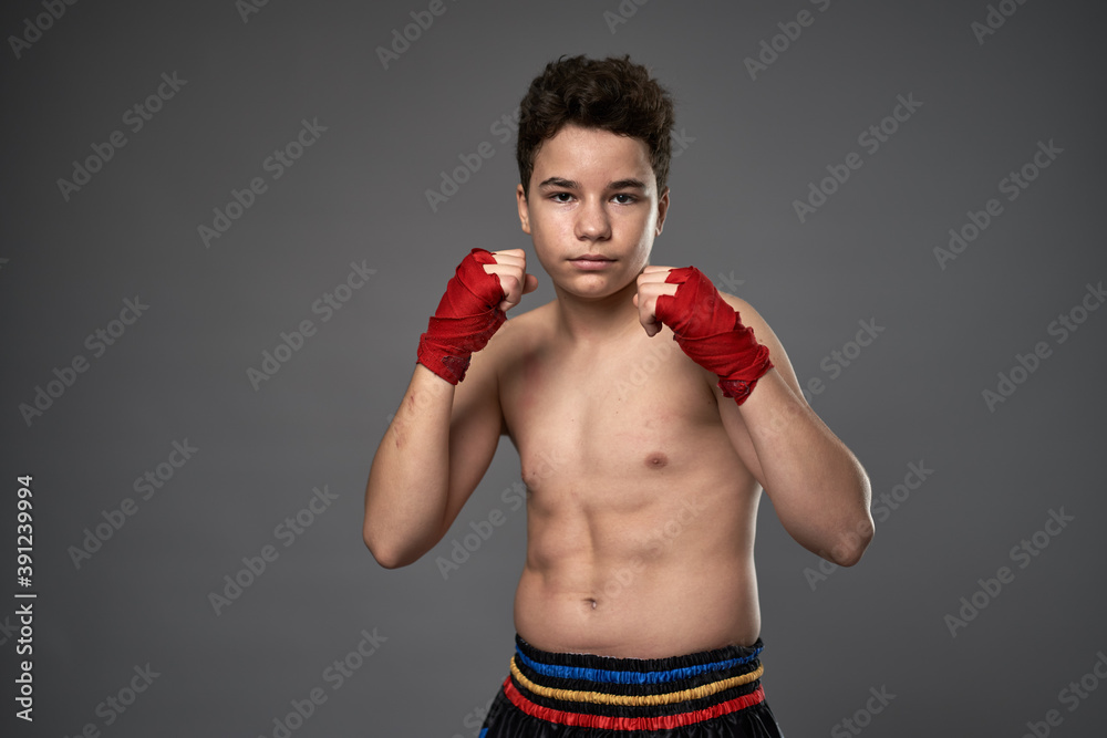 Teenage kickboxer training