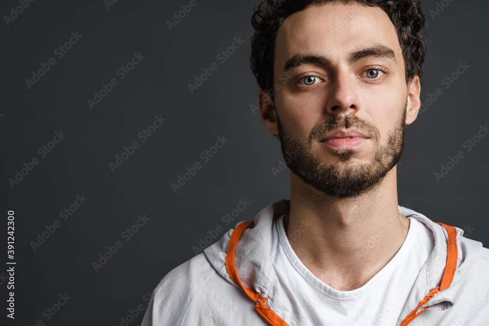 Unshaven handsome guy posing and looking at camera Unshaven handsome guy posing and looking at camera
