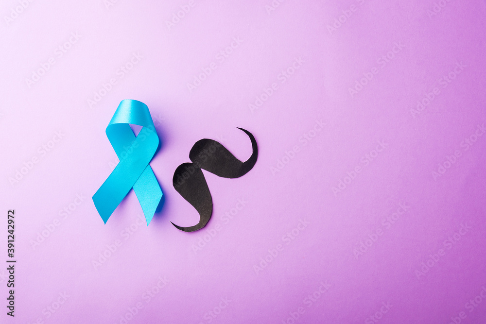 Black mustache paper and light blue ribbon, studio shot isolated on purple background, Prostate cancer awareness month, Fathers day, minimal November moustache concept