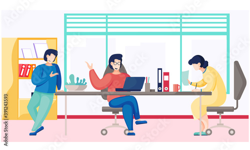 Businessmen dressed in casual clothes are sitting at the table with laptop and talking. Office workers discussing matters. Business meeting and consideration of working issues. Friendly team work