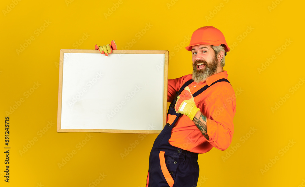 Visual outline. Repairman hold whiteboard copy space. Handsome repairman. Architect showing project. Professional repairman. Troubleshoot concept. Bearded man repairman builder. Plan repair works
