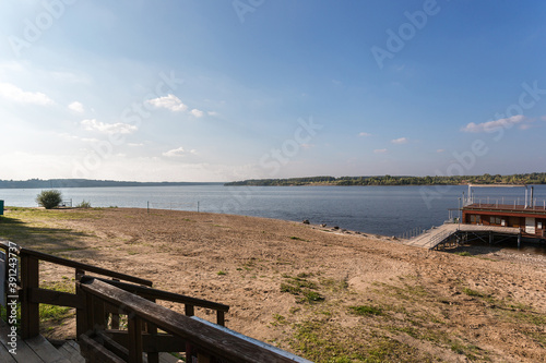 beautiful summer beach on the Volga river in sunny cool summer weather