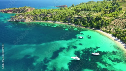 Aerial drone video of paradise beach of Tzortzi gialos with crystal clear turquoise sea, Alonissos island, Sporades, Greece  photo