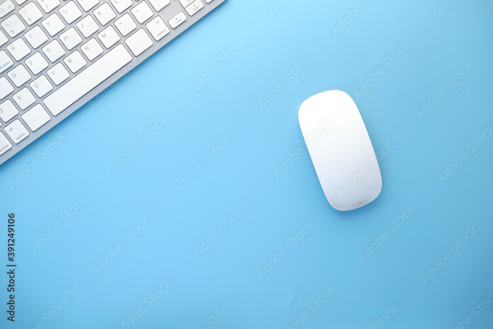 Top view of computer mouse, keyboard on blue background, Top view of computer mouse, keyboard on blue background,
