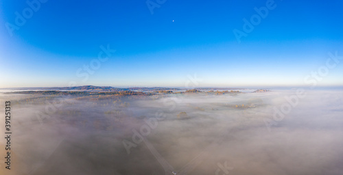 Drone image of morning ground fog over fields in the German province of North Hesse near the village of Rhoden