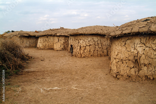 Fototapeta Mud hut in traditional masai village in Africa. Kenya. Masai Mara