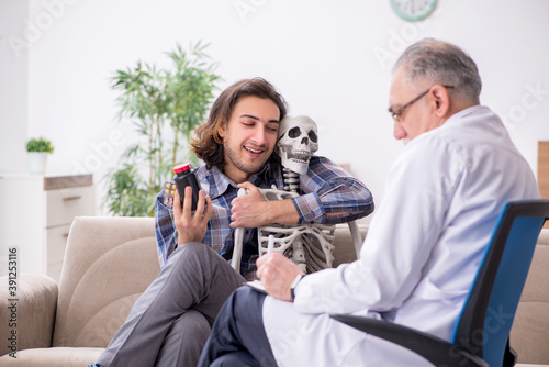 Young male patient visiting experienced doctor psychiatrist