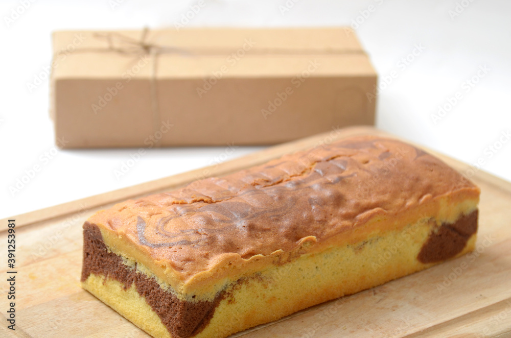 Medium size of Marmer cake, marble cake in wooden board with background packaging box Medium size of Marmer cake, marble cake in wooden board with background packaging box