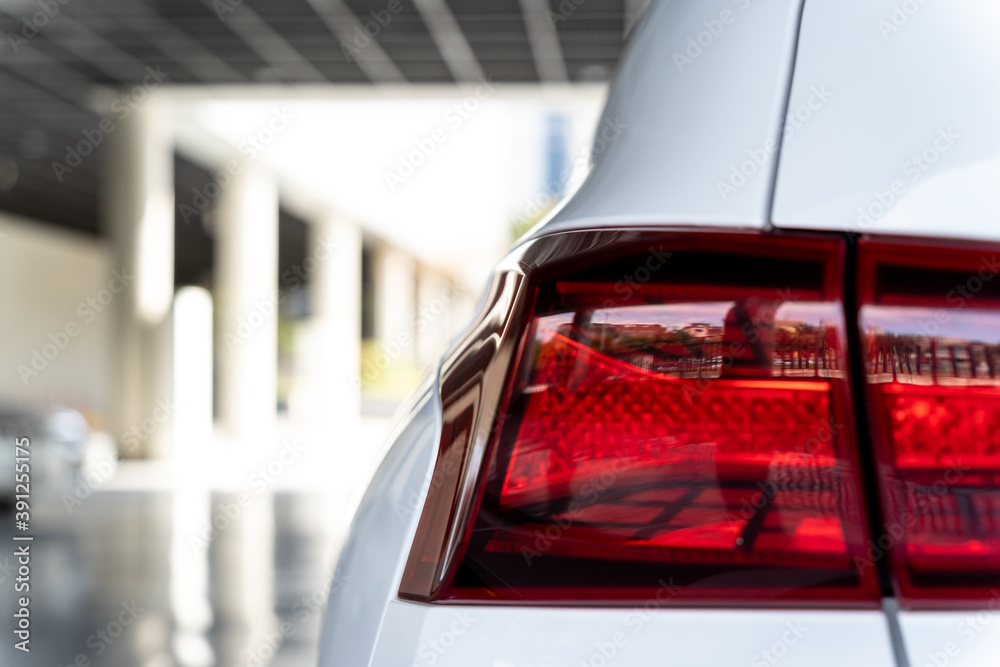 Close-up of the rear lights of the white SUV