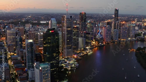 Cityscape Of Brisbane Central Business District With Brisbane River At Night In Brisbane, Queensland, Australia. - aerial drone shot photo