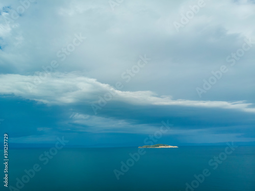 Fototapeta Naklejka Na Ścianę i Meble -  Dark blue sky and sea with island