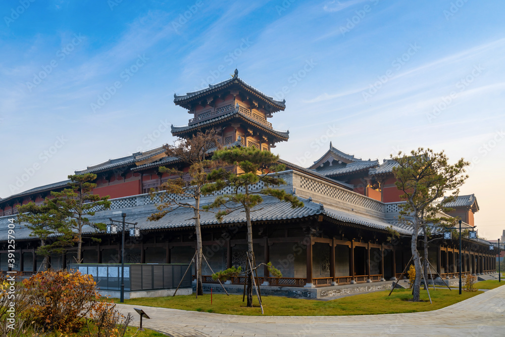Fototapeta premium In autumn, ancient building lofts and ginkgo trees are in Jinci Park, Taiyuan, Shanxi, China