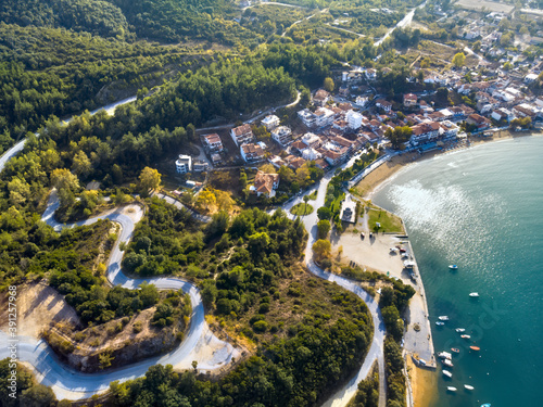 Aerial drone view of blue sea and windy mountain roads in Halkidiki photo