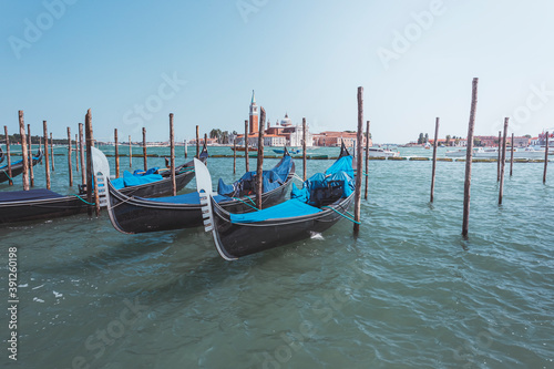 Venice, gondolas docked near the shore, Italy