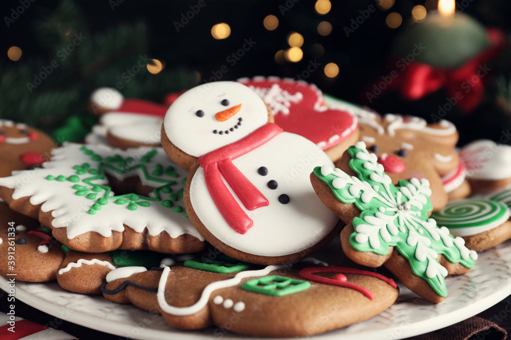 Delicious gingerbread Christmas cookies on plate, closeup