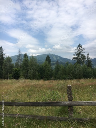 landscape with a fence and clouds