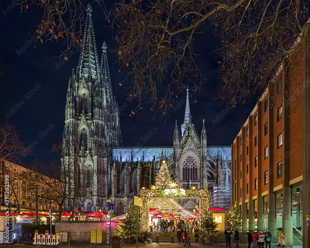 Cologne Cathedral Christmas Market in night, Germany. This is the most popular and best-known of all the city markets in front of the famous Cologne Cathedral.