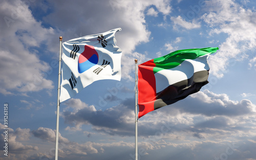 Beautiful national state flags of South Korea and UAE United Arab Emirates together at the sky background. 3D artwork concept.