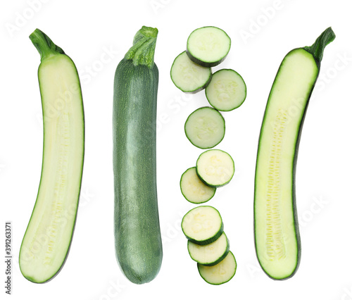 Set of fresh ripe zucchinis on white background, top view