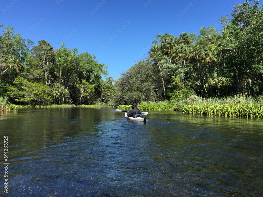 kayaker on the Chassahowizka River in wild central Florida
