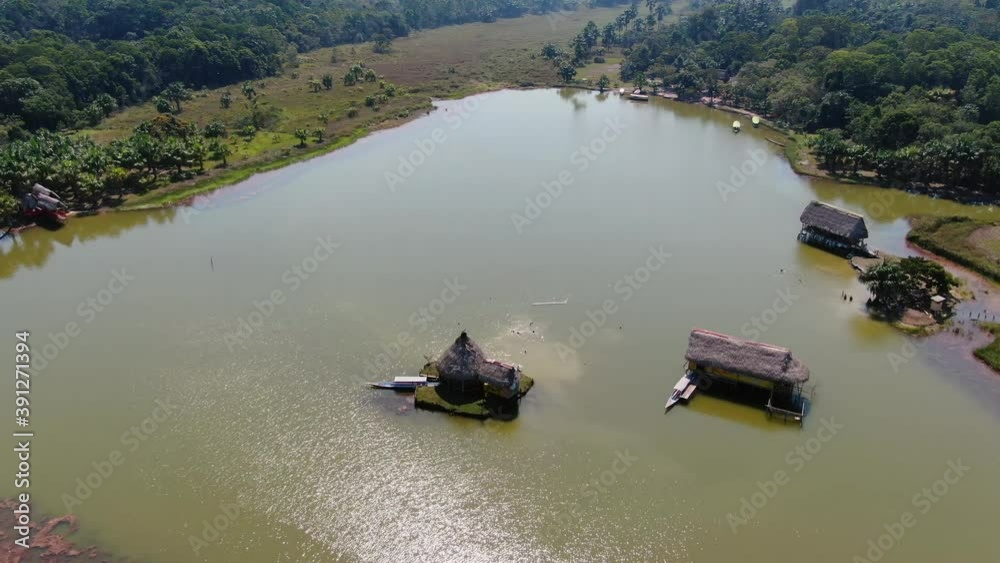 4K daytime aerial drone view - Laguna de los Milagros (Miracles Lakes), Tingo Maria in Peru, also known as the Gate to enter Amazon. Circular shot around a point of interest. Wide angle.