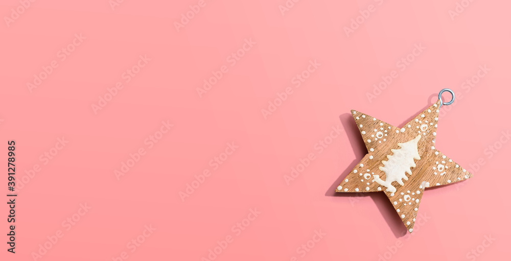 Christmas wooden star ornament from above - flat lay Christmas wooden star ornament from above - flat lay